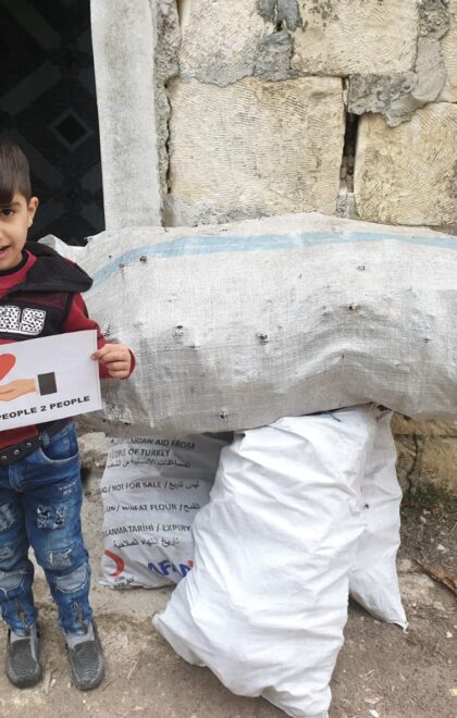 syrian child boy fire wood donation